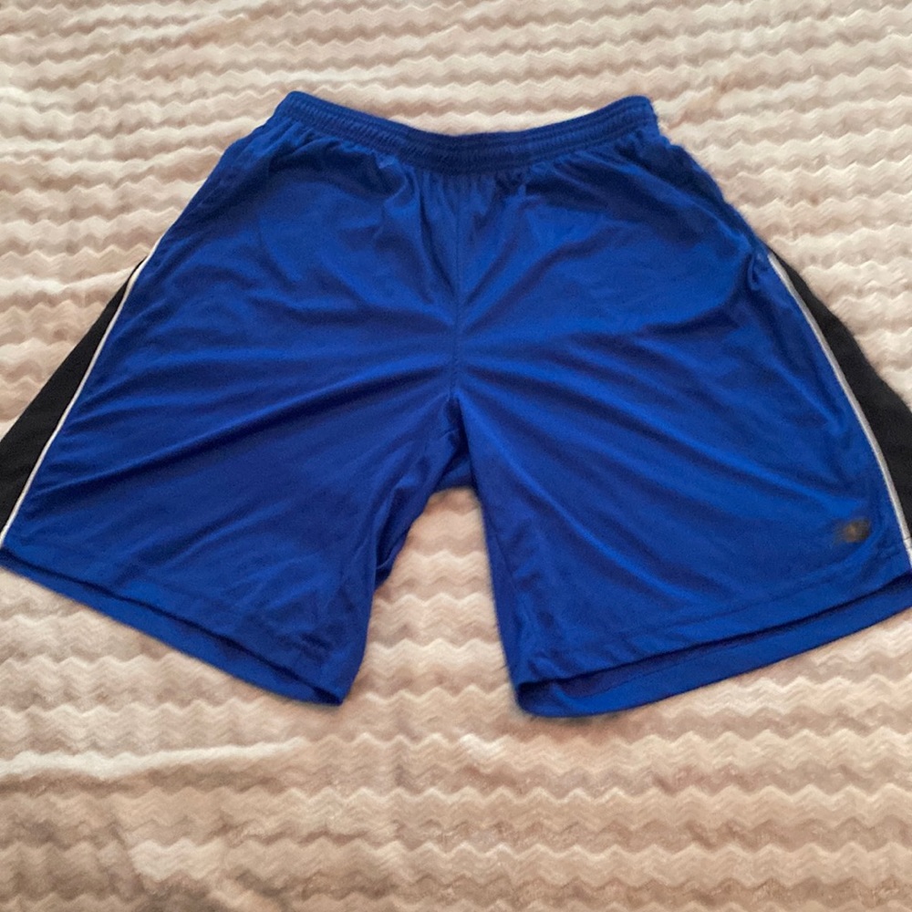 New Balance lightning dry shorts. Blue with black stripe. Size s.